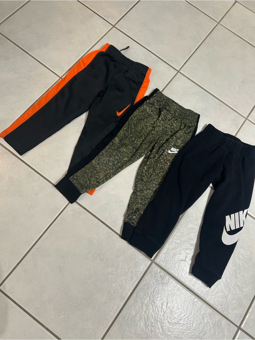 Nike Kids Three-Pack Joggers in Black, Orange & Olive